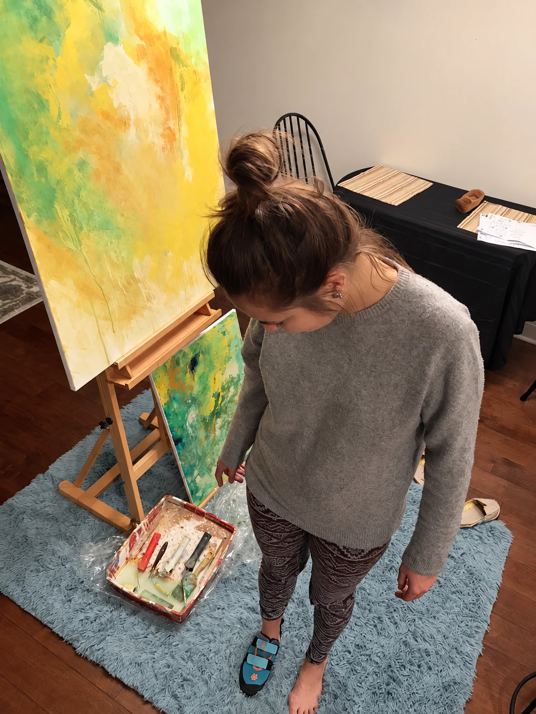 Zuzana in her studio, surrounded by her original paintings